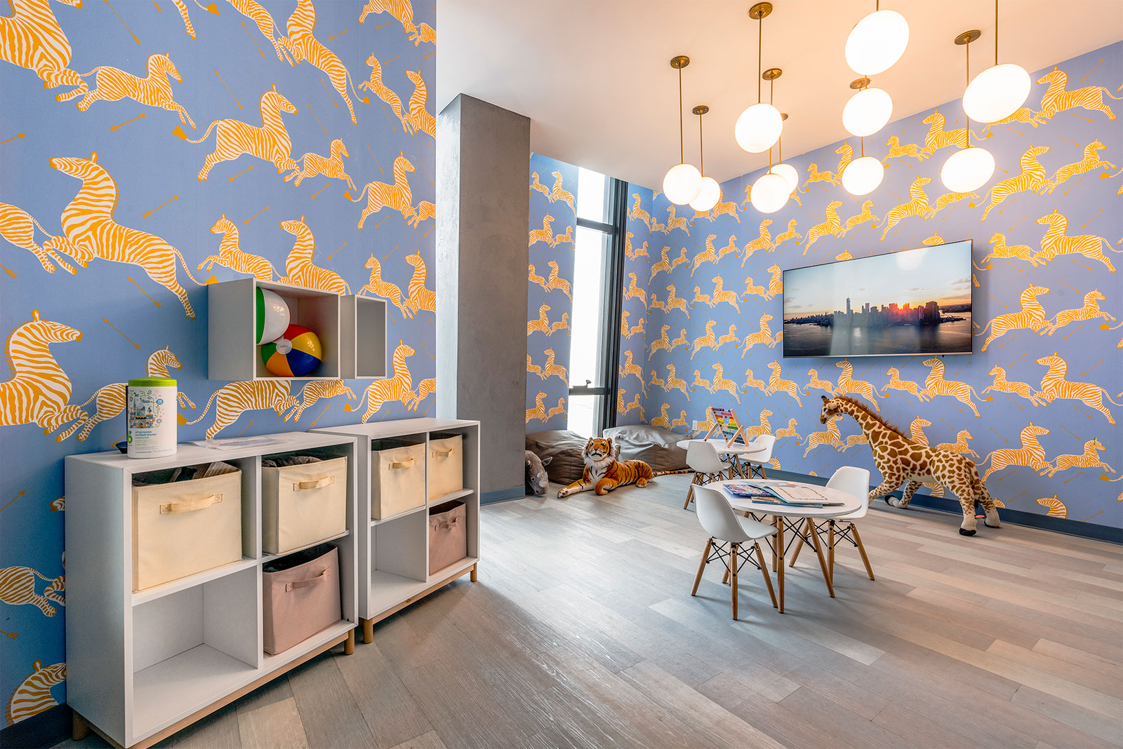 Cozy children’s playroom at The Copper apartments in NYC, designed with bright colors and fun features for little residents.