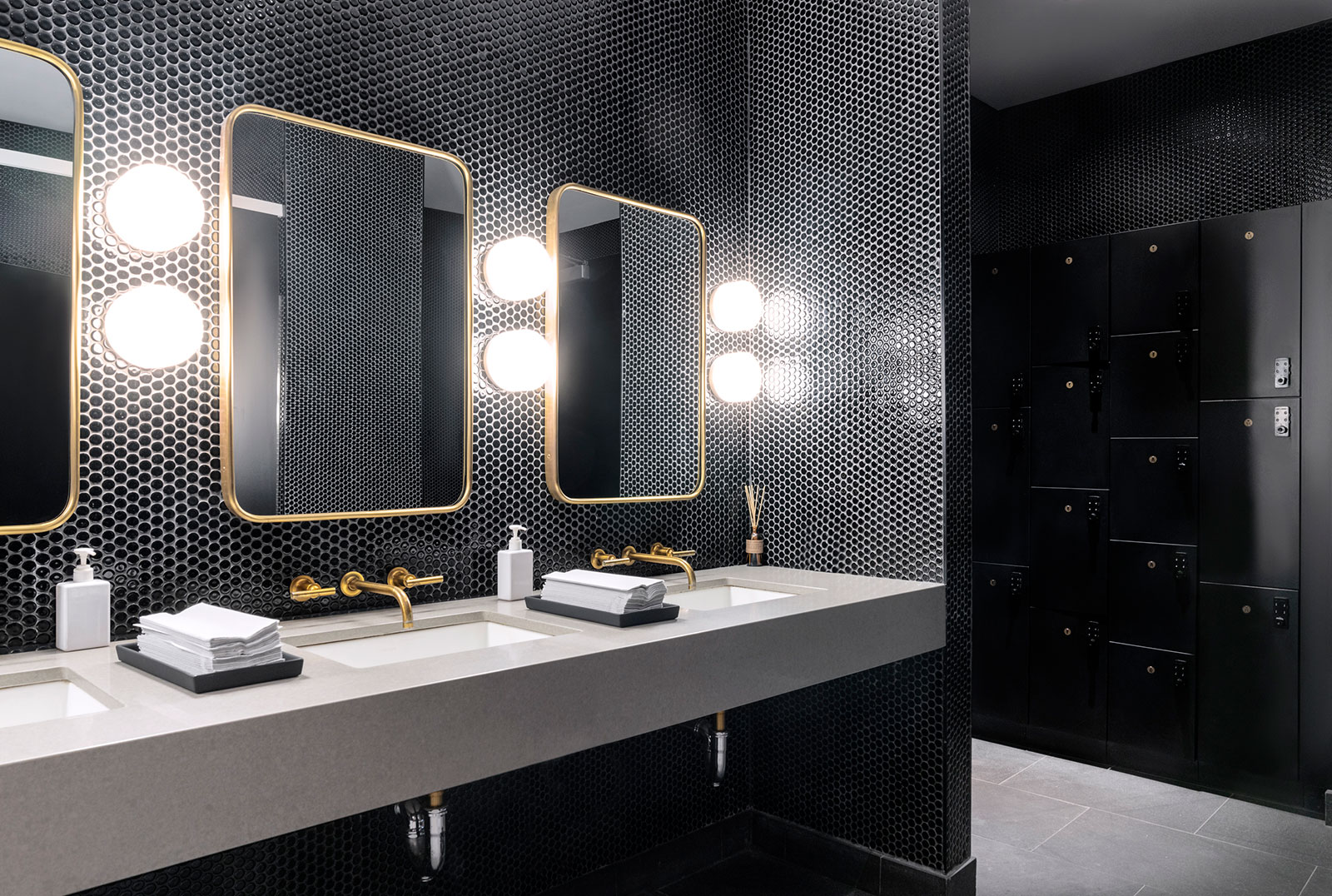 Luxury locker rooms w/showers at The Copper rentals in Midtown East NYC, providing residents a sleek & comfortable amenity.