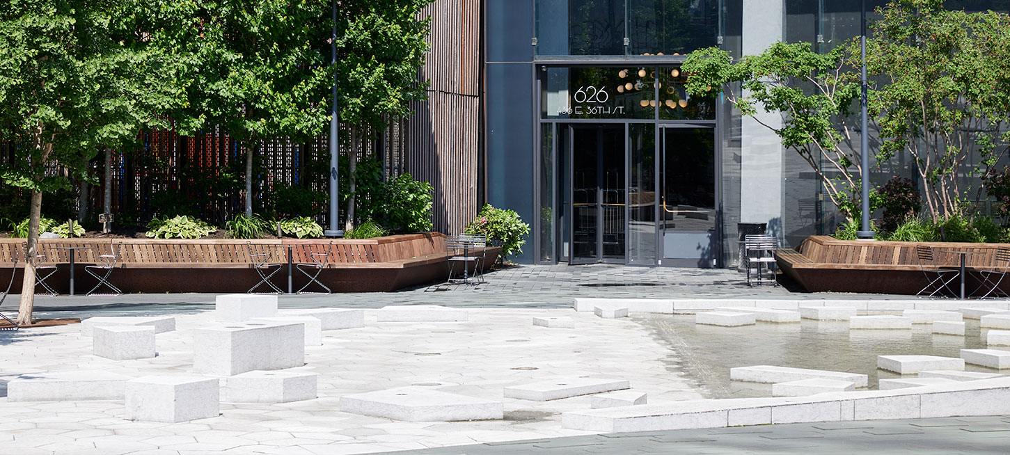 Beautiful outdoor plaza at The Copper apartments in Murray Hill, providing residents a vibrant space to relax and socialize.
