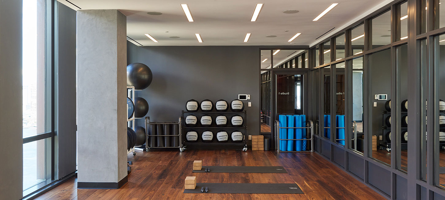 Luxury Yoga Studio amenity at The Copper apartments in NYC, offering residents a well-equipped space for workouts and yoga.