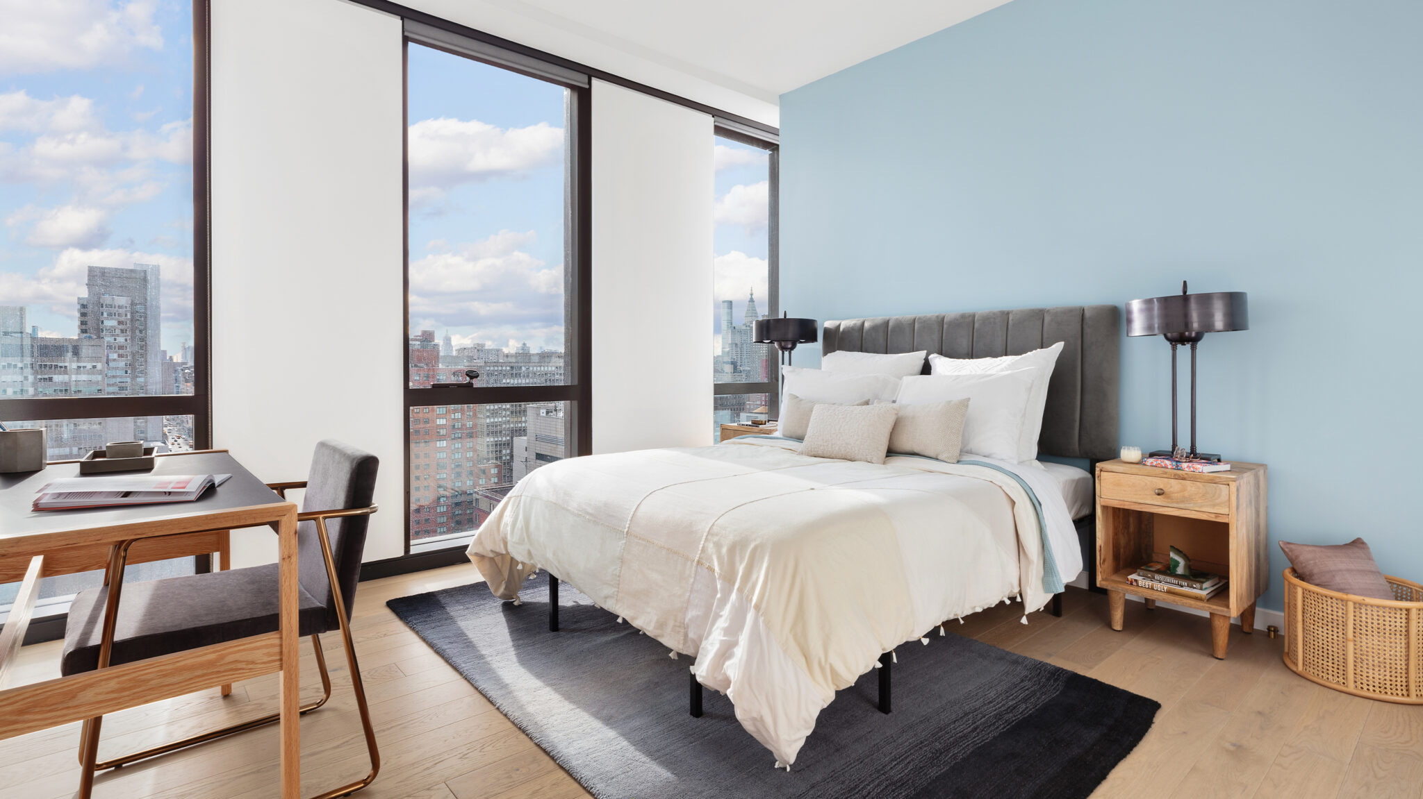 Spacious bedroom at The Copper in Murray Hill with natural light, city views, and room for a queen-size bed plus extra space.