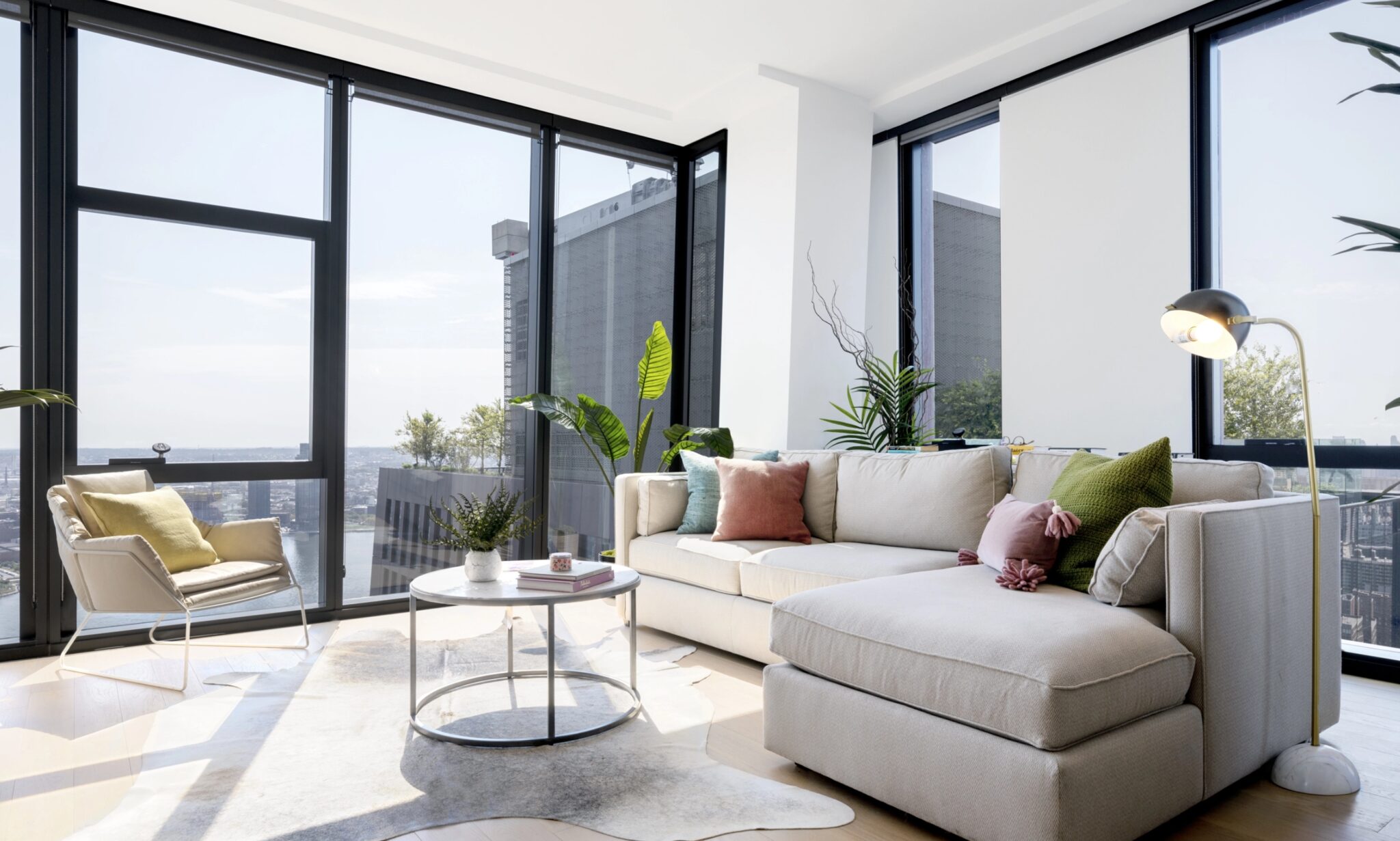 Spacious living room with elegant hardwood floors at The Copper apartments in Murray Hill, combining comfort and style.