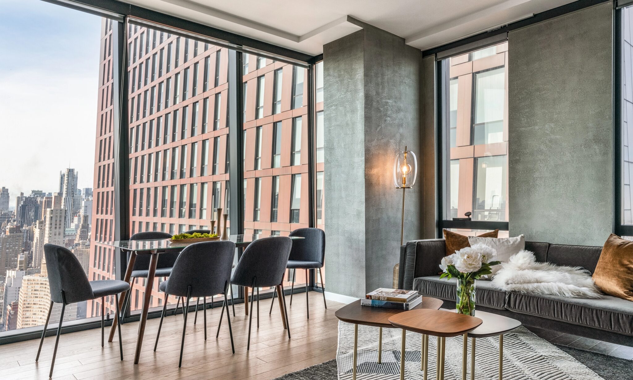 Beautiful, modern, and cozy living room at The Copper in Murray Hill, featuring hardwood floors and a spacious layout.