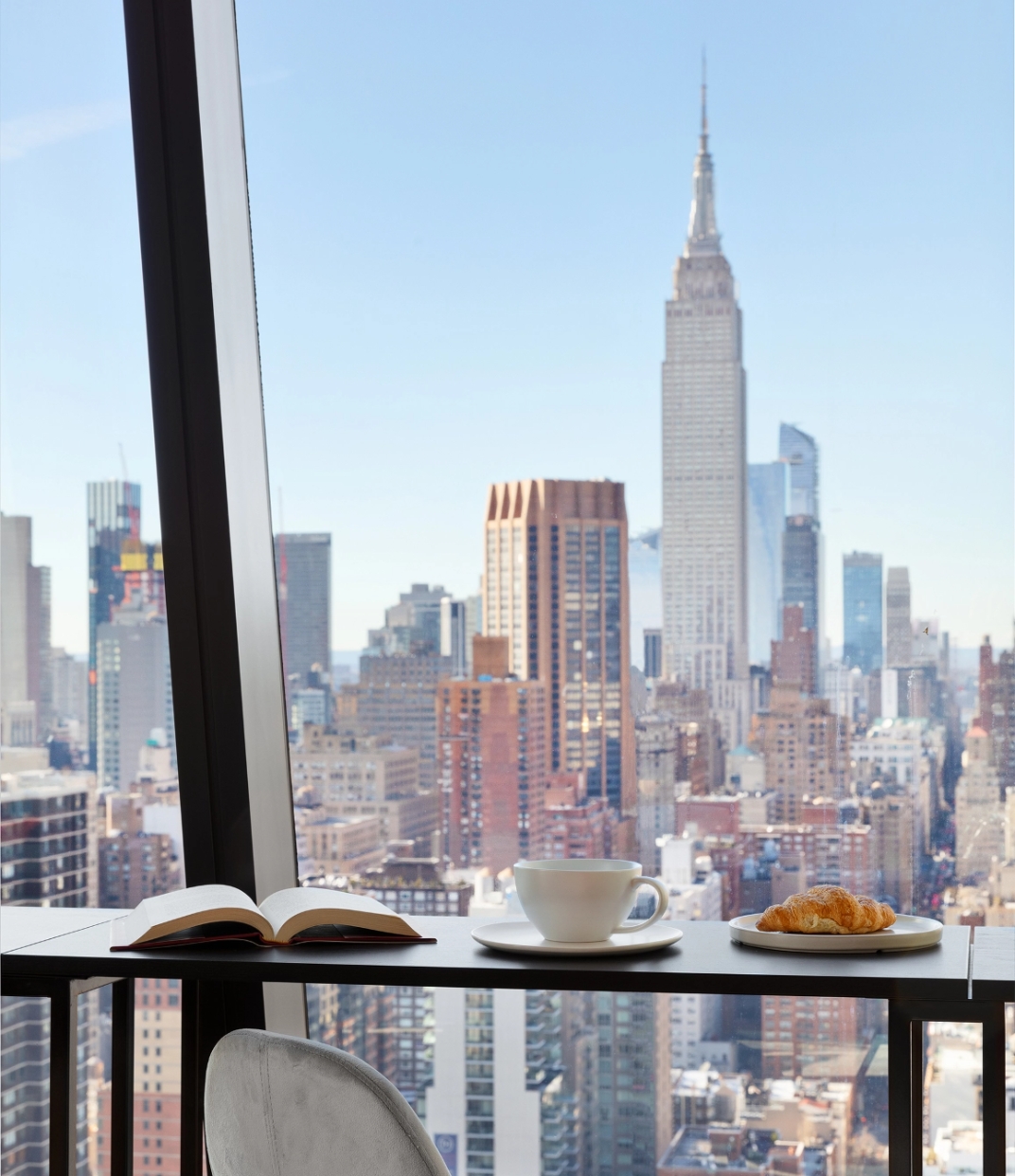 Gorgeous dining space at The Copper apartments in Murray Hill, offering beautiful Manhattan views to enjoy with every meal.