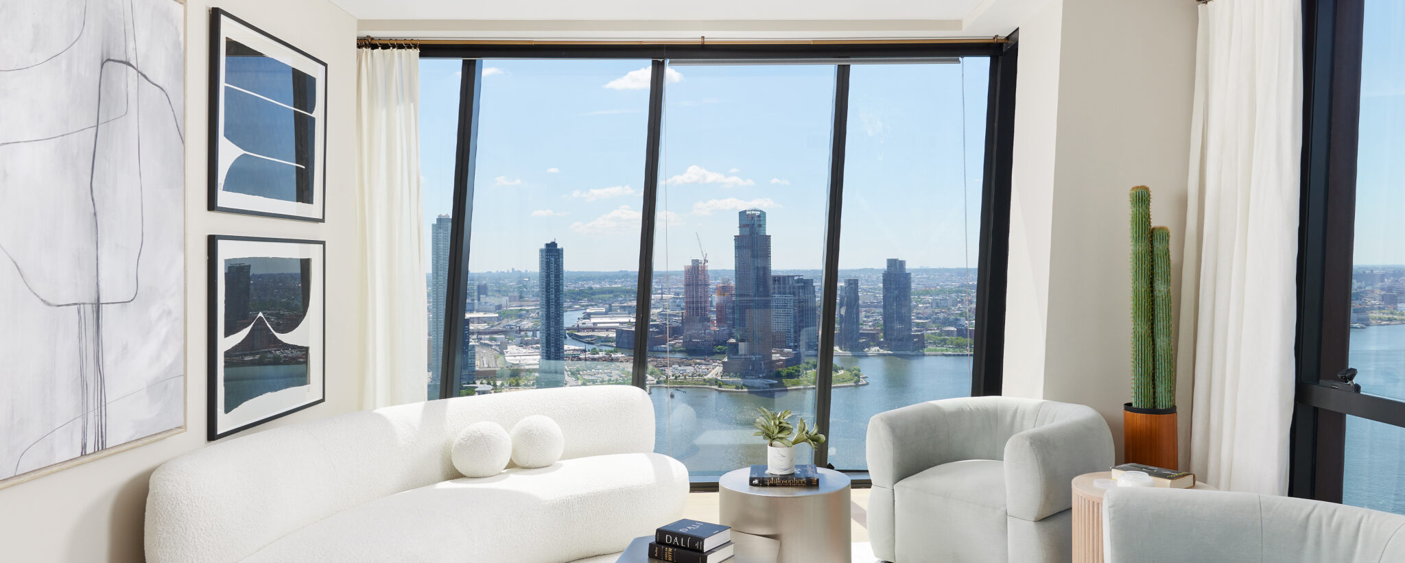 Luxurious living room at The Copper apartments in Murray Hill with modern interior design and stunning East River views.