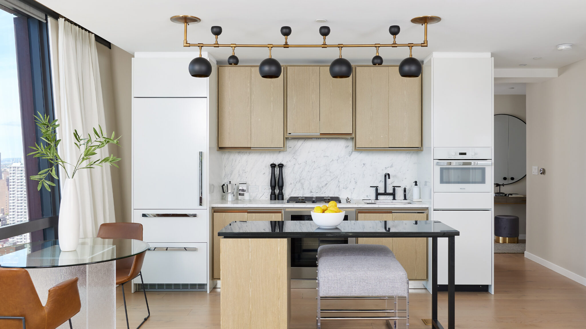 Spacious kitchen with island, new appliances & dining area at luxury rental apartments at The Copper in Murray Hill.